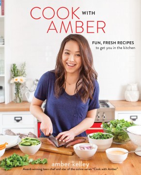 The author smiling and cutting vegetables on a cutting board