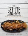 Cover of book The gefilte manifesto, with black plate of brown gefilte fish on a white background